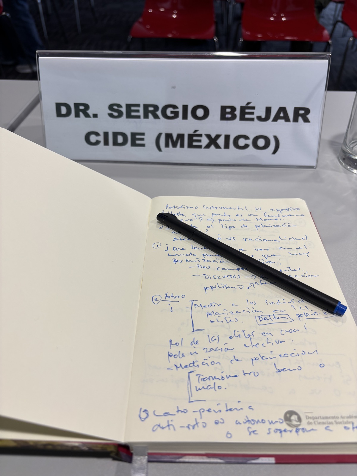 Conference agenda, nameplate for Dr. Sergio Béjar of CIDE, and handwritten research notes