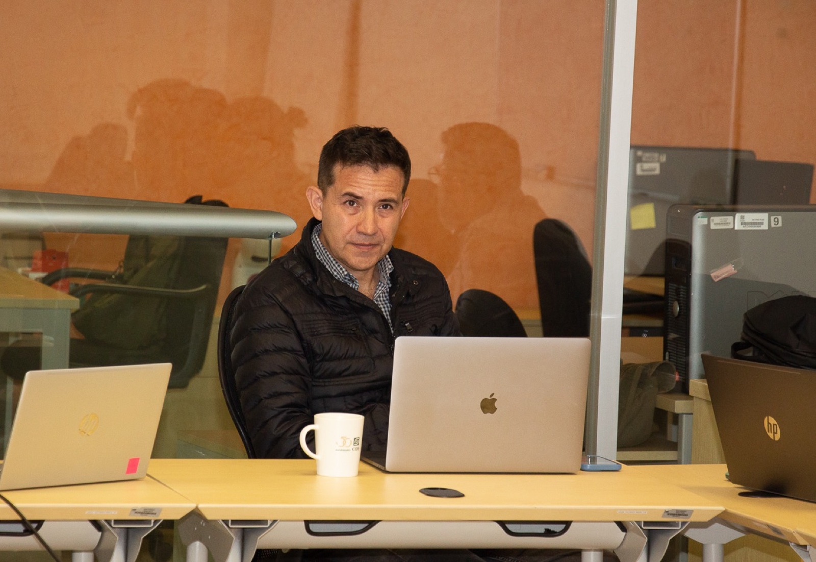 Sergio Béjar López working at a laptop at CIDE